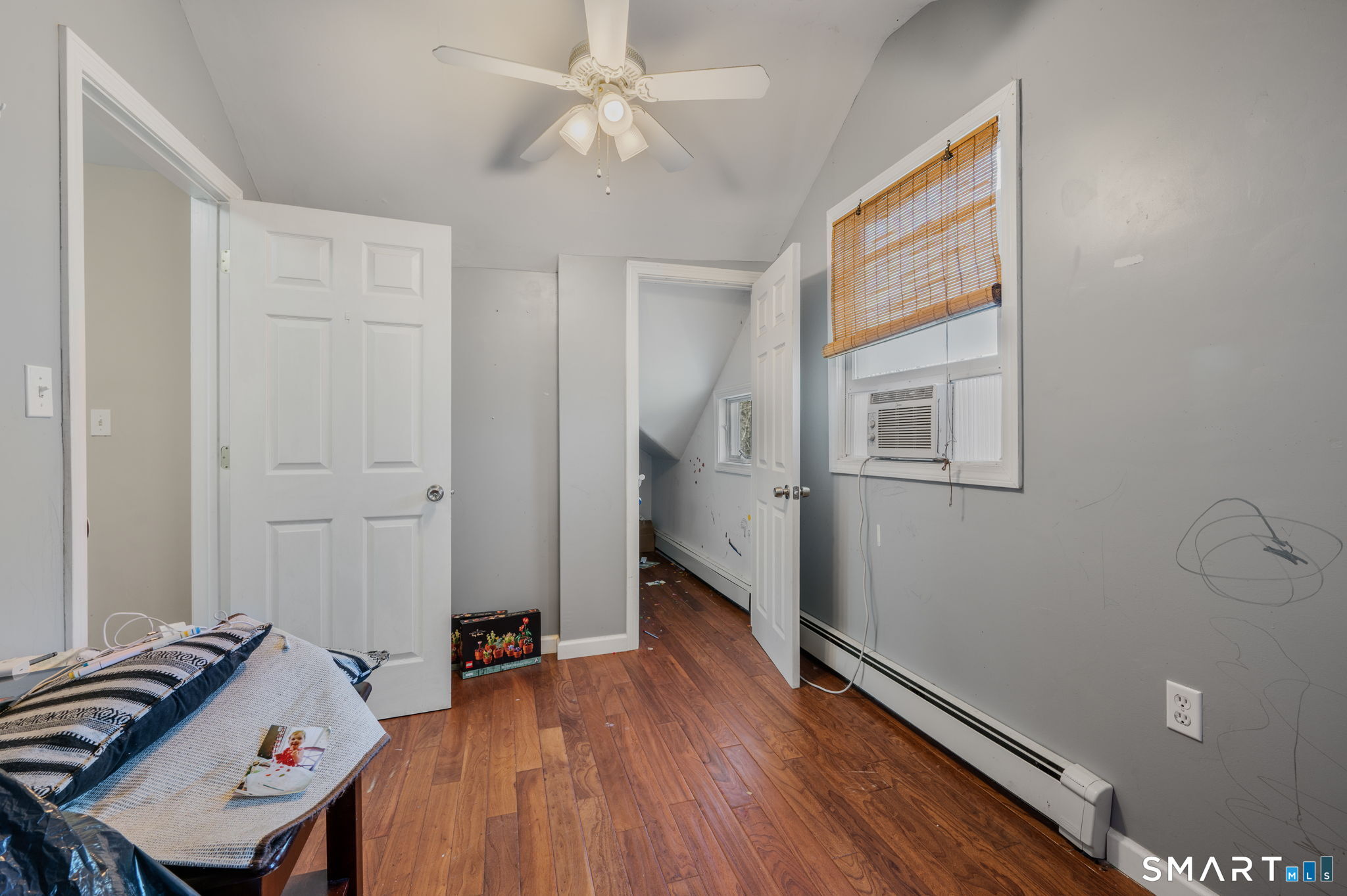 55 Bentley Avenue Norwich, CT 06360 - Photo 11 of 24 wooden floor in an empty room with a window