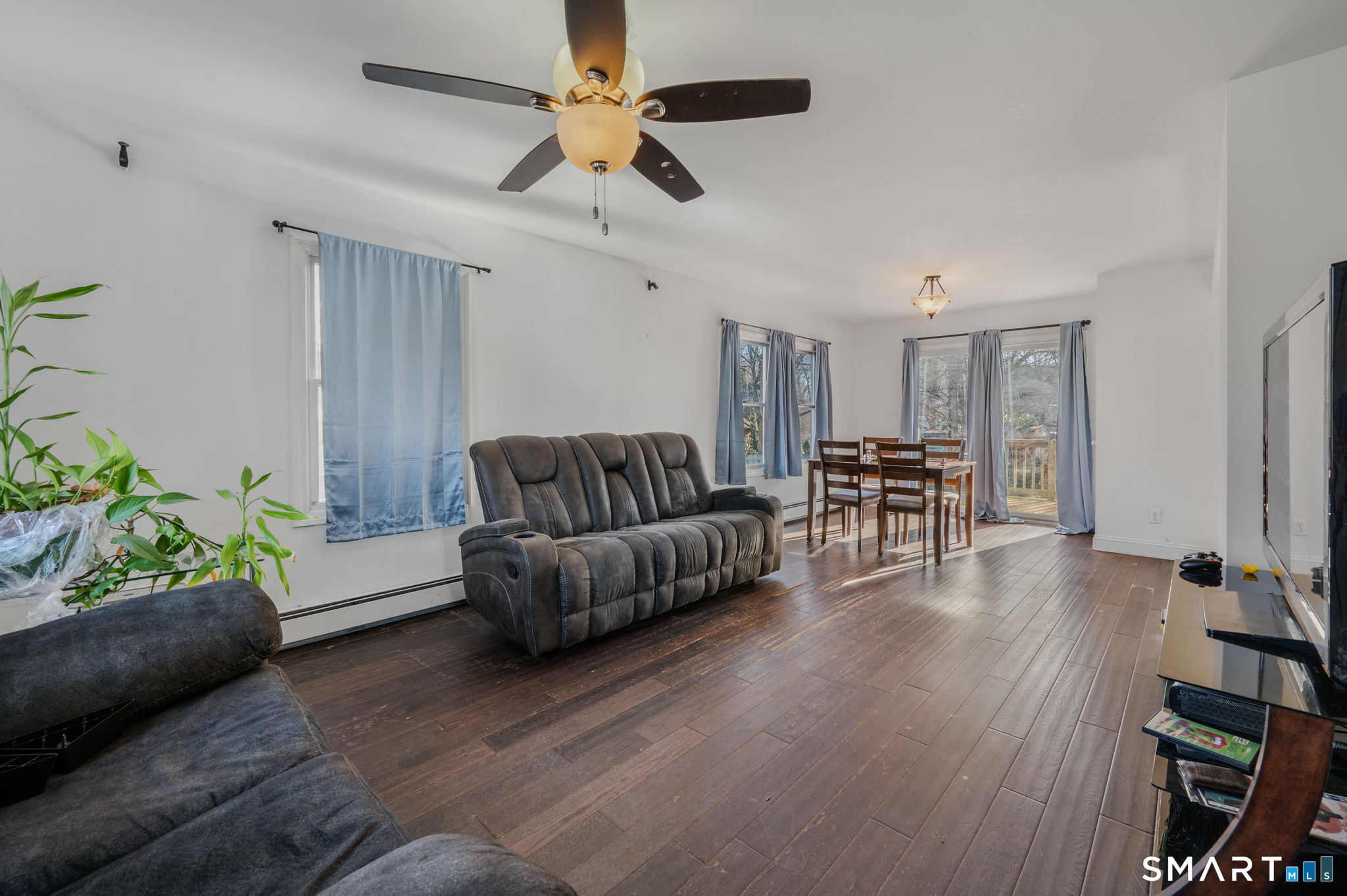 55 Bentley Avenue Norwich, CT 06360 - Photo 4 of 24 a living room with furniture and wooden floor