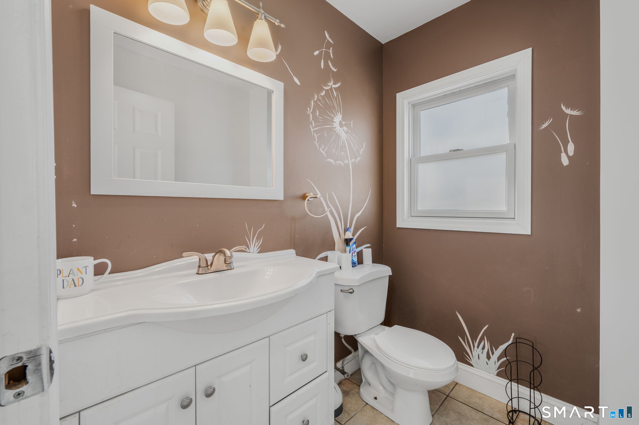 55 Bentley Avenue Norwich, CT 06360 - Photo 9 of 24 a bathroom with a toilet sink and mirror