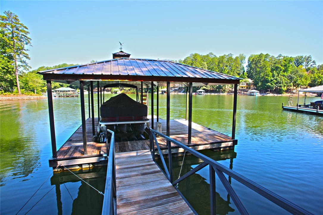 1359 Hbr Rdg Road Seneca, SC 29672 - Photo 22 of 39 Boathouse with a covered dock and private boat slip, perfectly positioned for tranquil lake enjoyment.