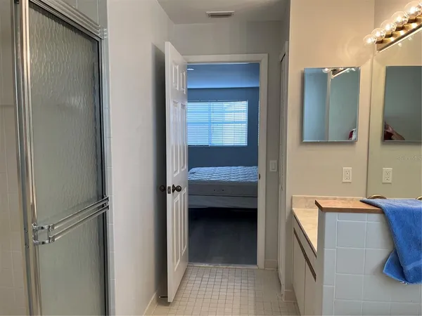 a en suite bathroom with a sink and a mirror