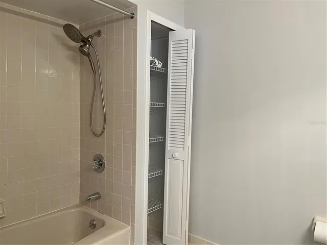 a bathroom with a shower and a bathtub