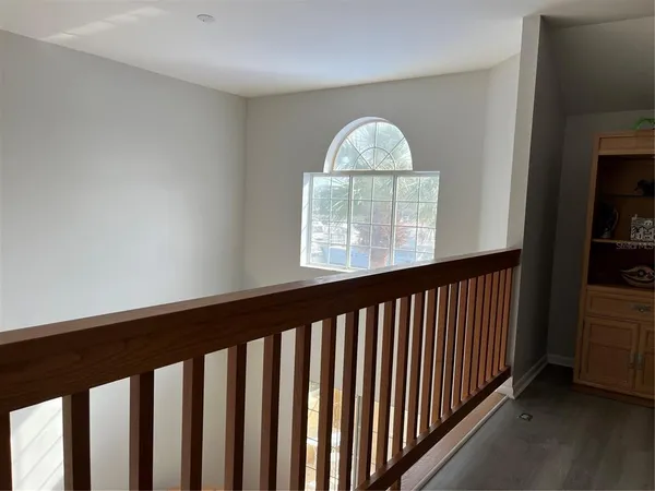 a view of staircase with rug floor