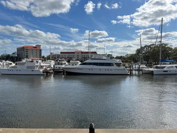 a view of a lake with boats and trees