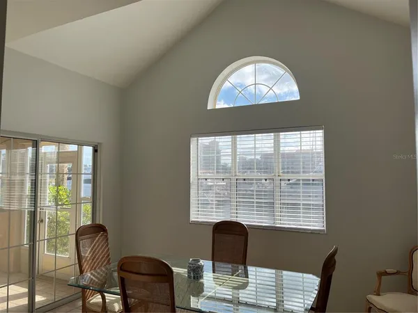 a work room with furniture and a window