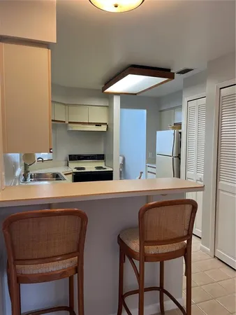 a dining room with table chairs and wooden floor