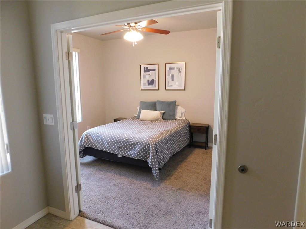 3370 South Ridge Avenue Bullhead City, AZ 86429 - Photo 50 of 56 a bedroom with a bed and painting on the wall