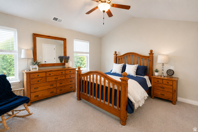 896 Cres Drive South Mapleton, UT 84664 - Photo 13 of 32 Spacious bedroom featuring vaulted ceilings, light-colored walls, and neutral carpet flooring