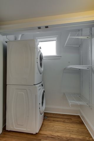 a view of a livingroom with washer and dryer