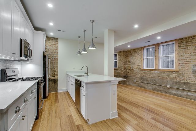 a kitchen with sink and cabinet