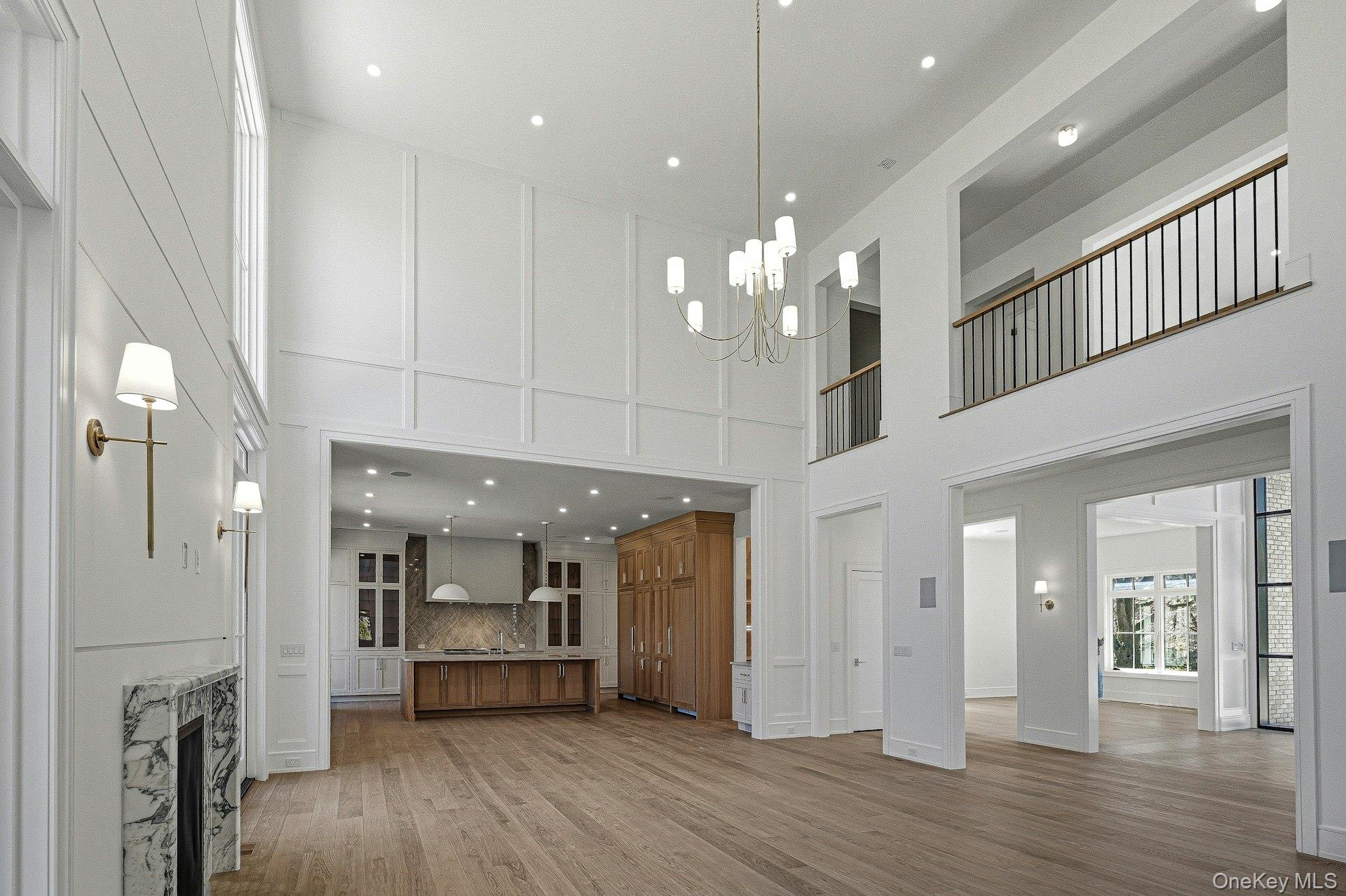 25 West Creek Farms Road Sands Point, NY 11050 - Photo 9 of 39 a view of a big room with kitchen and chandelier