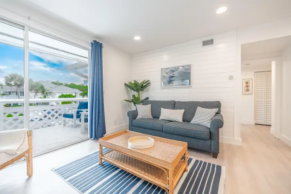 a living room with furniture and a rug