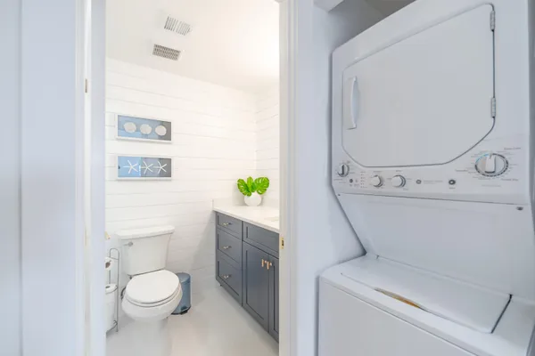 a bathroom with a toilet a sink and a mirror