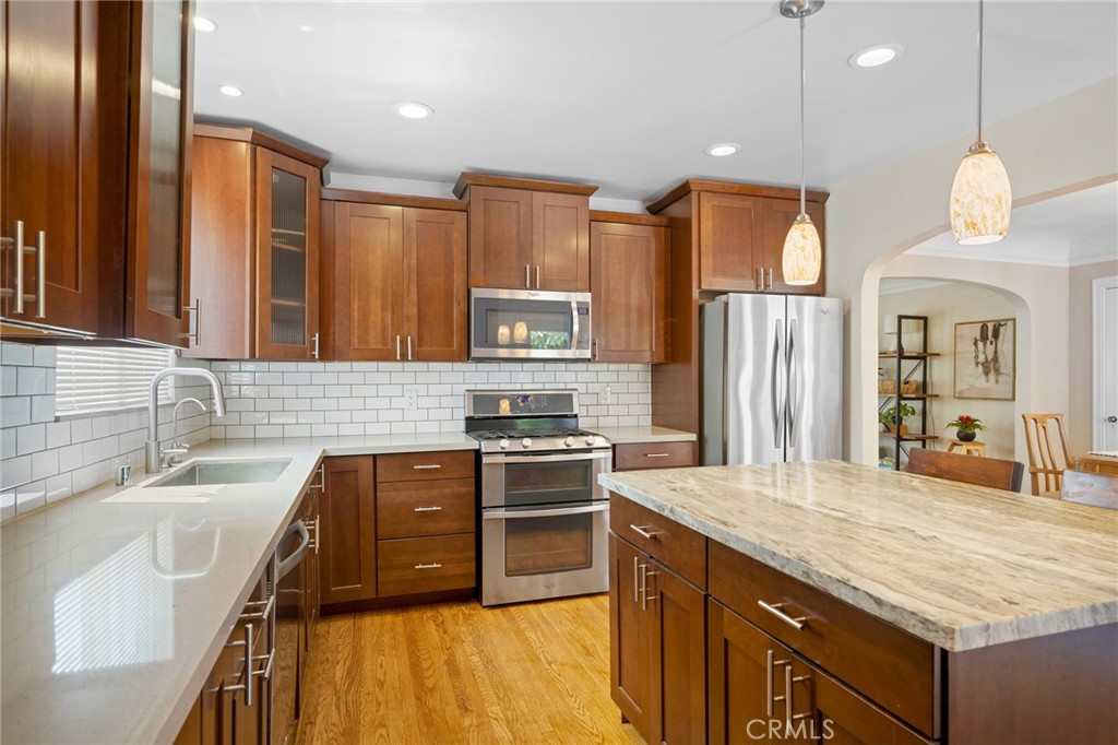 635 Arden Avenue Glendale, CA 91202 - Photo 11 of 36 a kitchen with granite countertop a sink stainless steel appliances and cabinets