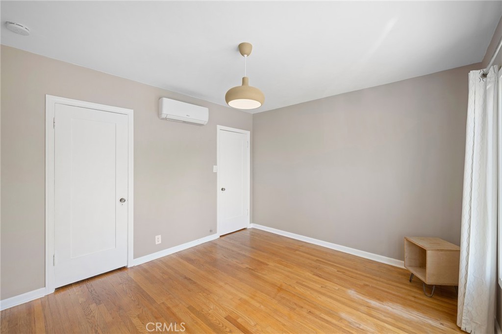 635 Arden Avenue Glendale, CA 91202 - Photo 14 of 36 a view of a room with wooden floor and white walls