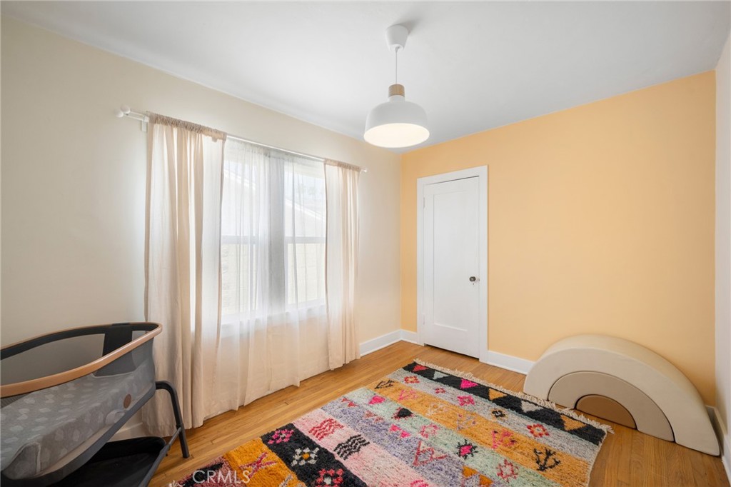 635 Arden Avenue Glendale, CA 91202 - Photo 17 of 36 a bedroom with a bed and a window