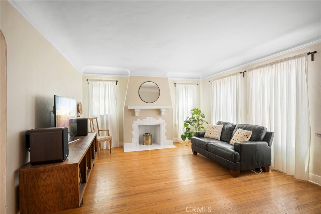 635 Arden Avenue Glendale, CA 91202 - Photo 30 of 36 a living room with furniture and a fireplace