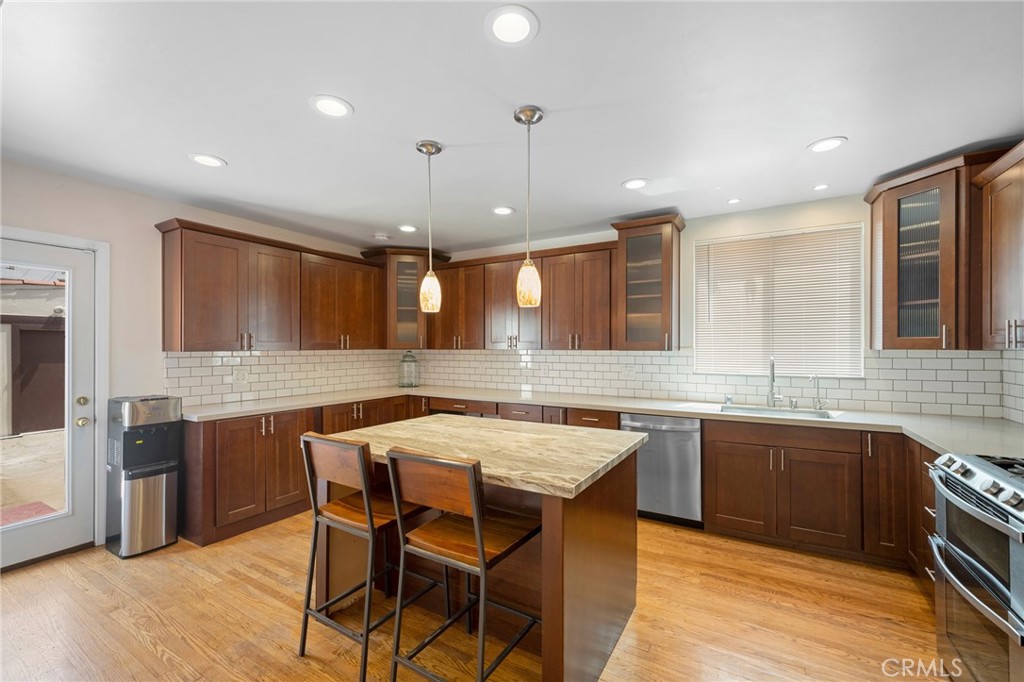 635 Arden Avenue Glendale, CA 91202 - Photo 10 of 36 a kitchen with granite countertop a sink counter top space and stainless steel appliances