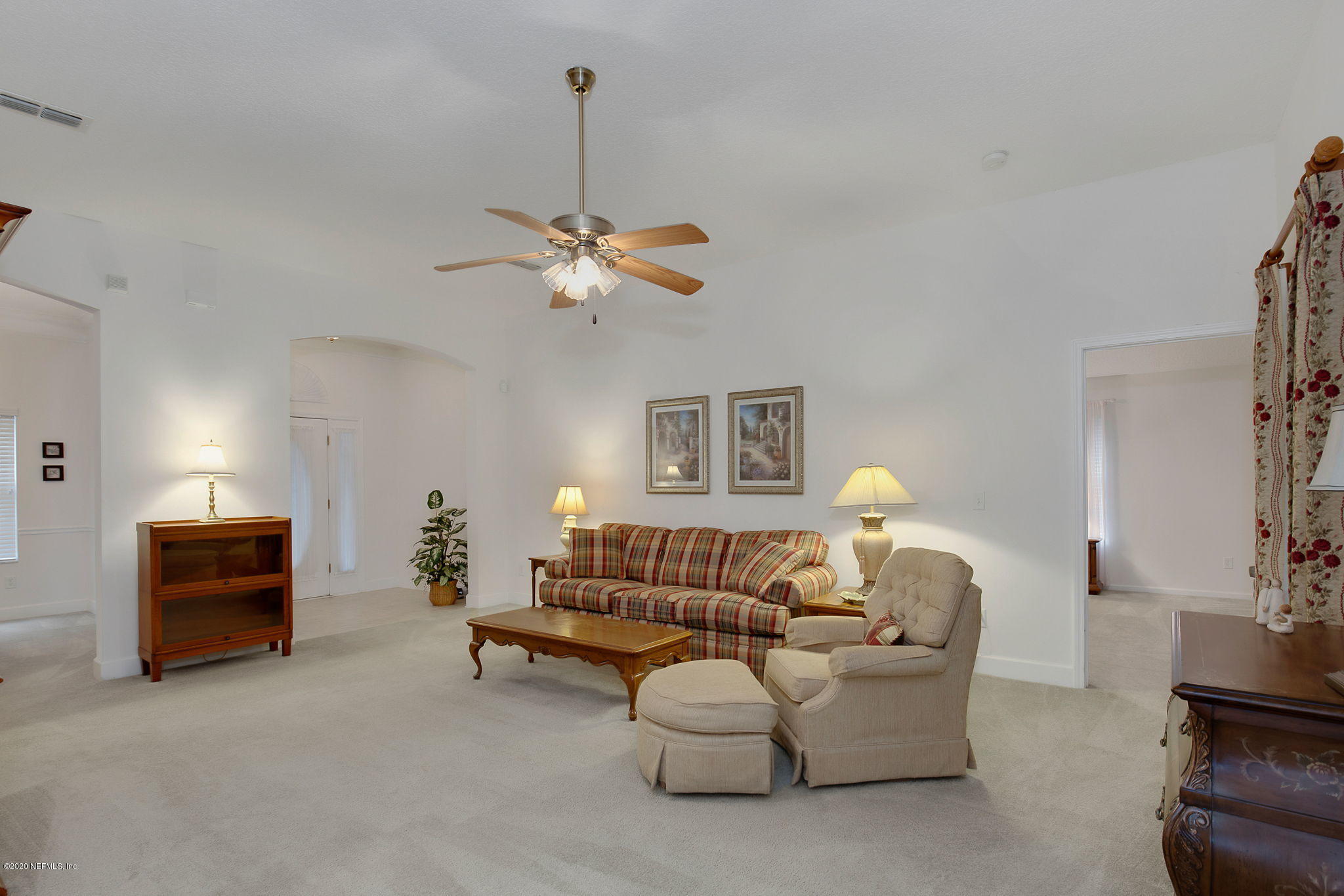 1545 Crichton Road West Jacksonville, FL 32221 - Photo 11 of 30 a living room with furniture and a chandelier