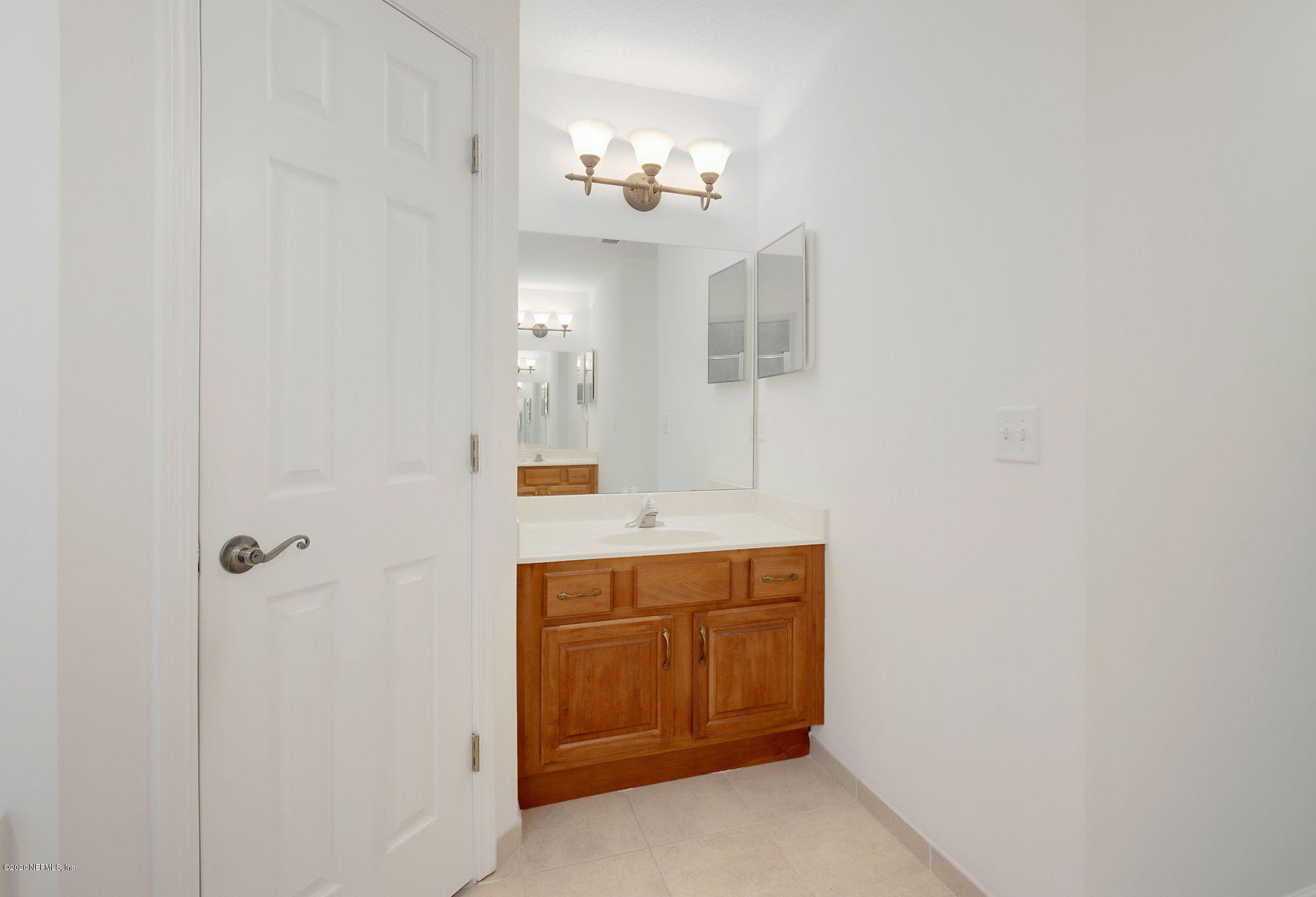 1545 Crichton Road West Jacksonville, FL 32221 - Photo 15 of 30 a bathroom with a sink a light fixture and a mirror