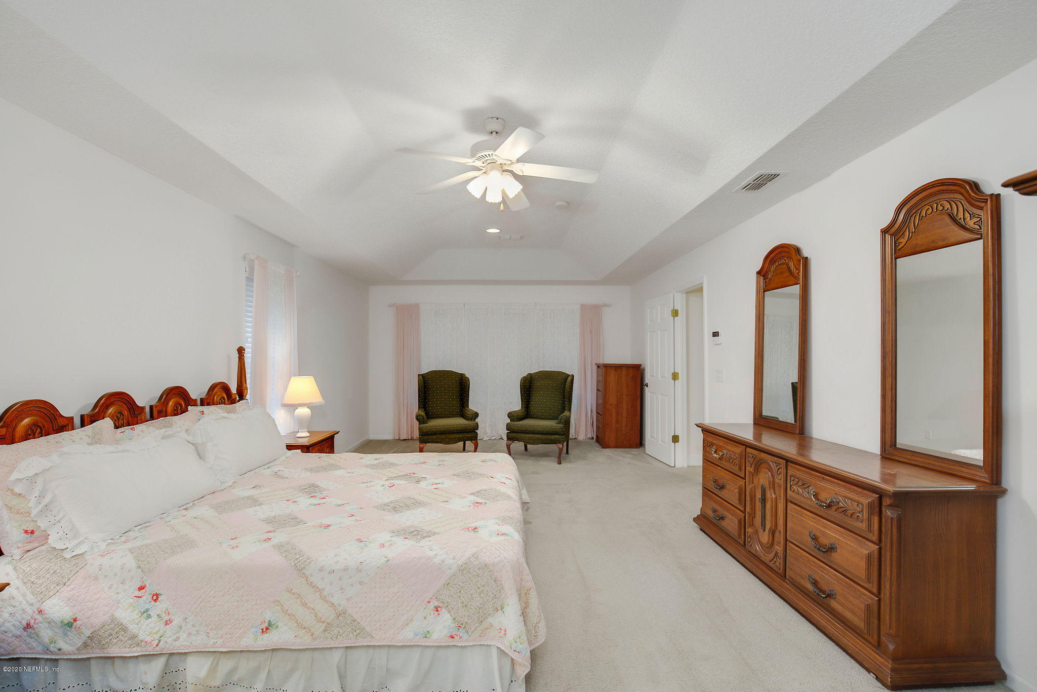 1545 Crichton Road West Jacksonville, FL 32221 - Photo 16 of 30 a bed room with two bed and a chandelier