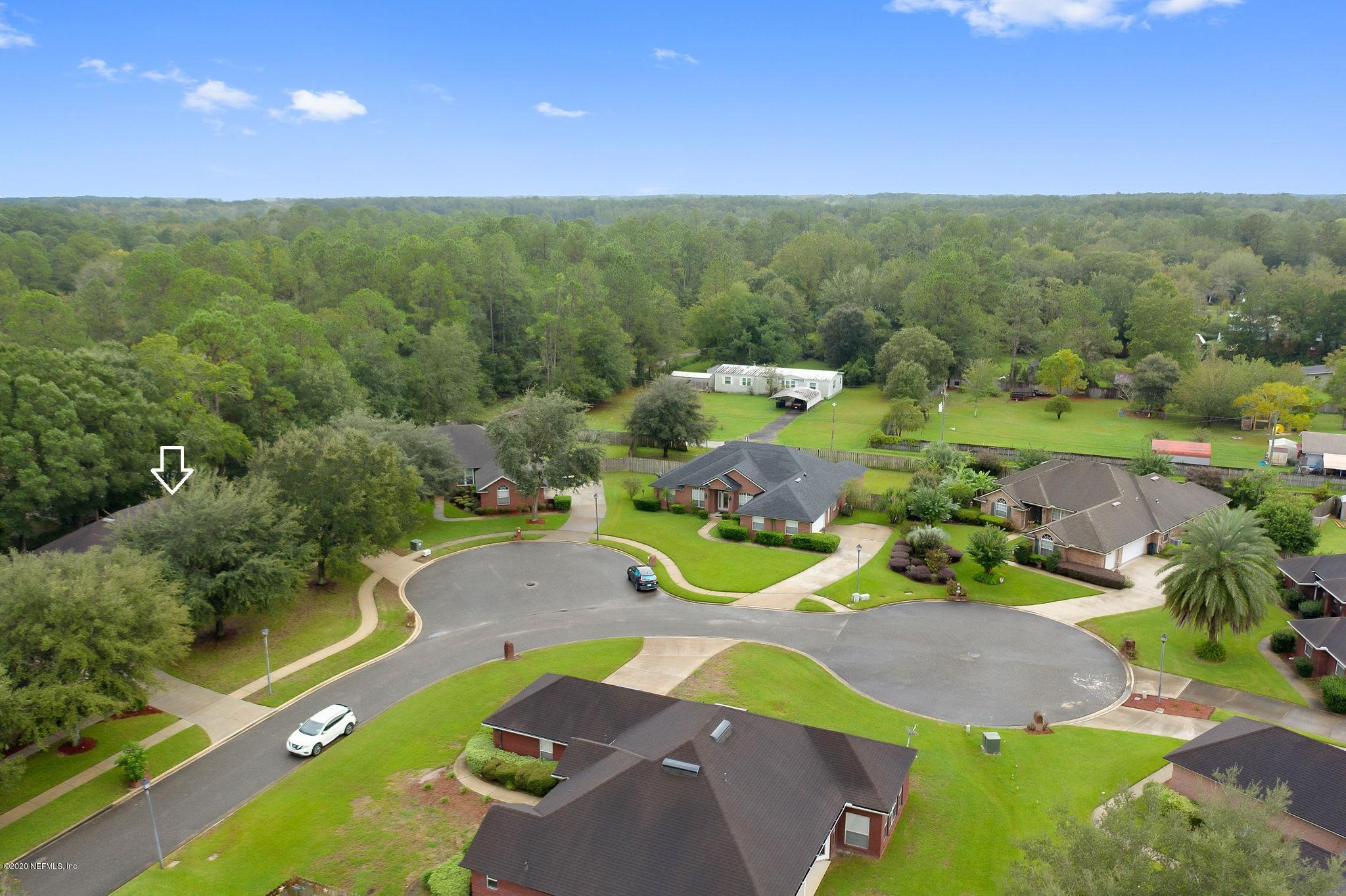 1545 Crichton Road West Jacksonville, FL 32221 - Photo 2 of 30 a view of a swimming pool with a yard