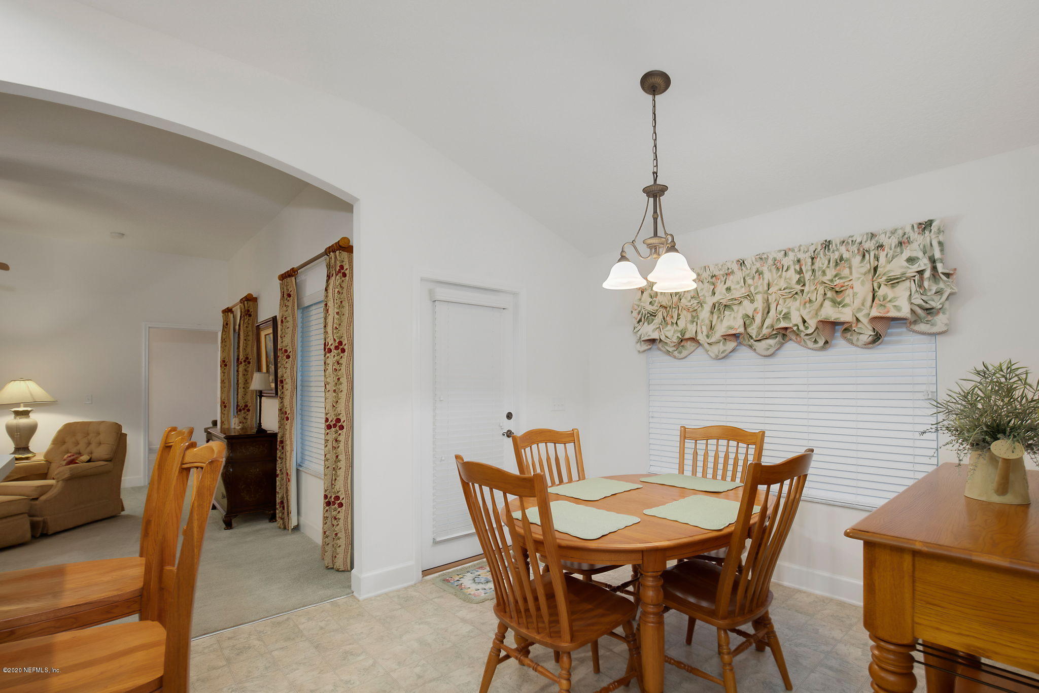 1545 Crichton Road West Jacksonville, FL 32221 - Photo 21 of 30 a dining room with furniture and chandelier