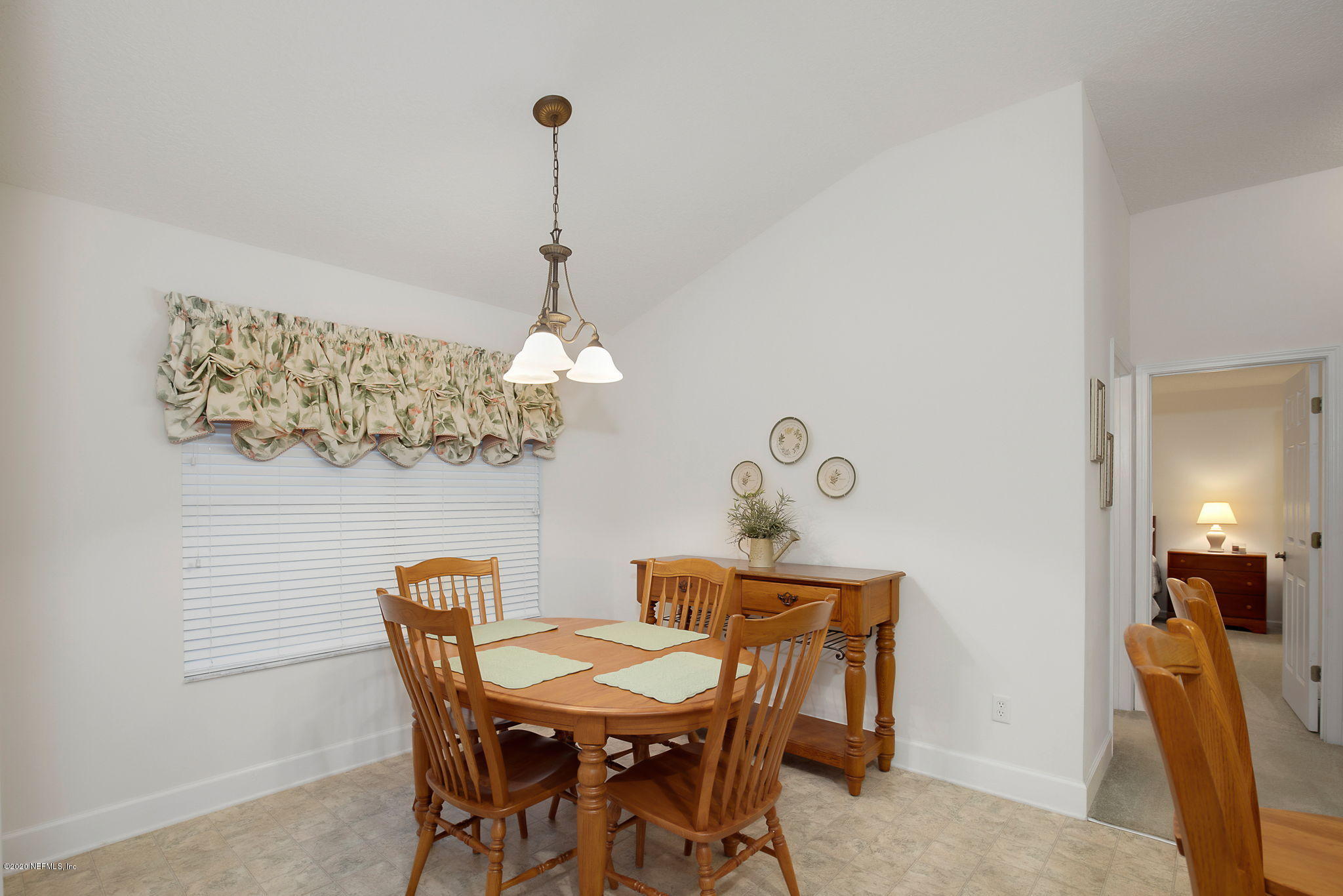 1545 Crichton Road West Jacksonville, FL 32221 - Photo 22 of 30 a view of a dining room with furniture and chandelier