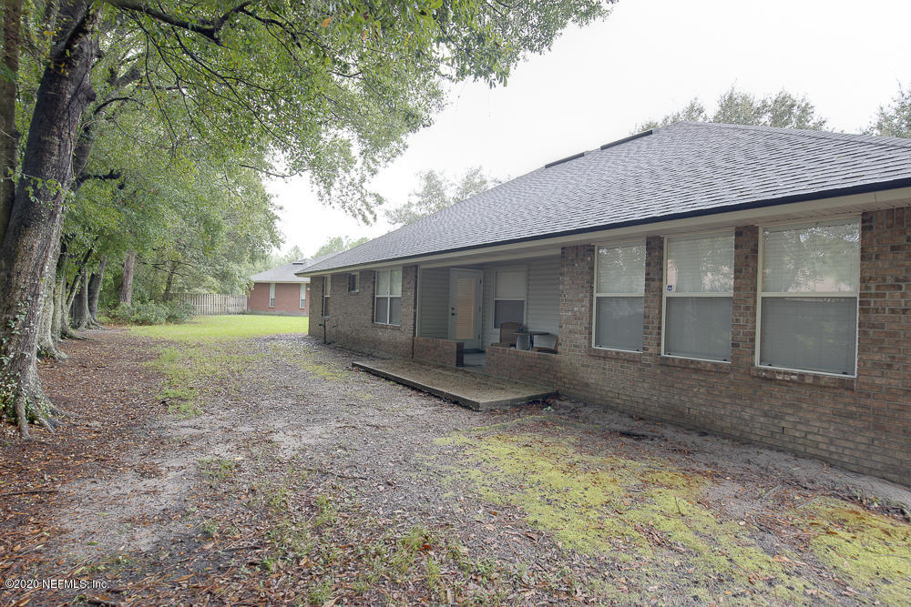1545 Crichton Road West Jacksonville, FL 32221 - Photo 27 of 30 a view of a house with a yard and large tree