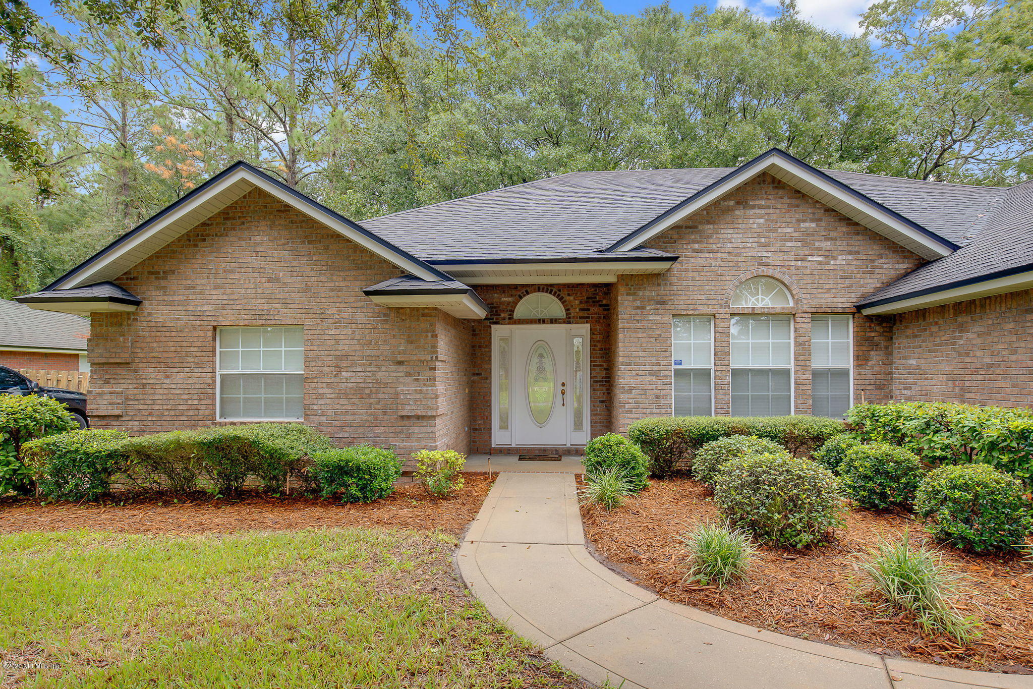 1545 Crichton Road West Jacksonville, FL 32221 - Photo 5 of 30 a view of a house with garage and plants