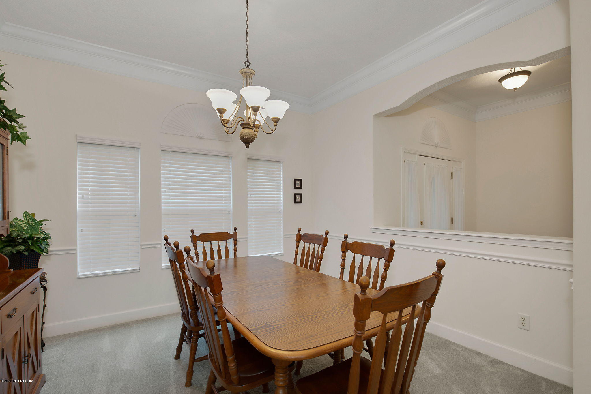 1545 Crichton Road West Jacksonville, FL 32221 - Photo 9 of 30 a view of a dining room with furniture and chandelier