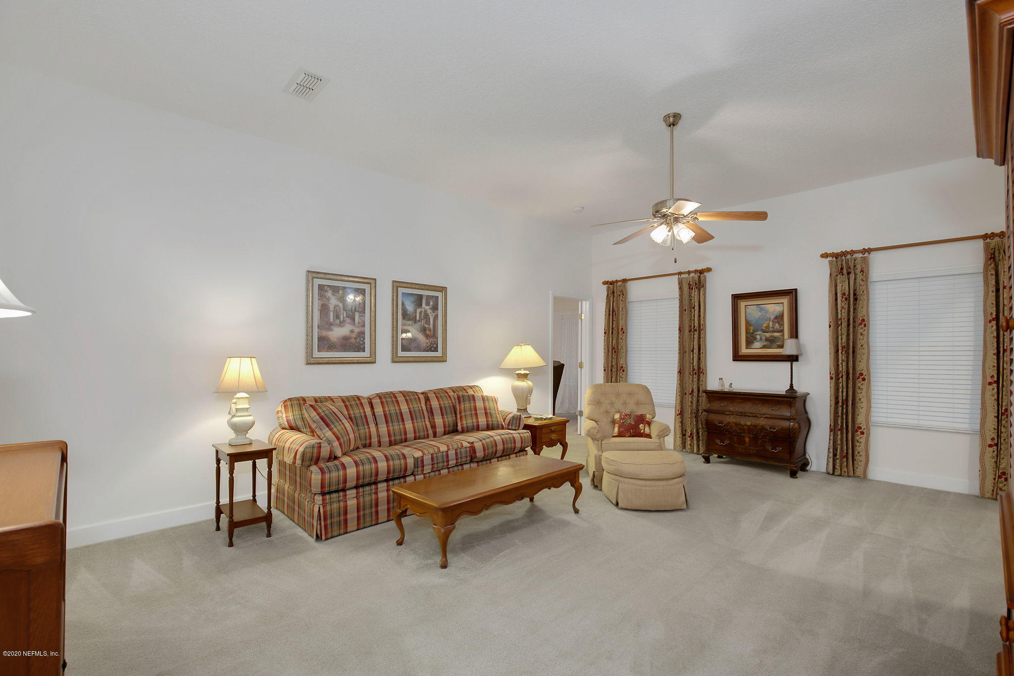 1545 Crichton Road West Jacksonville, FL 32221 - Photo 10 of 30 a living room with furniture and a chandelier