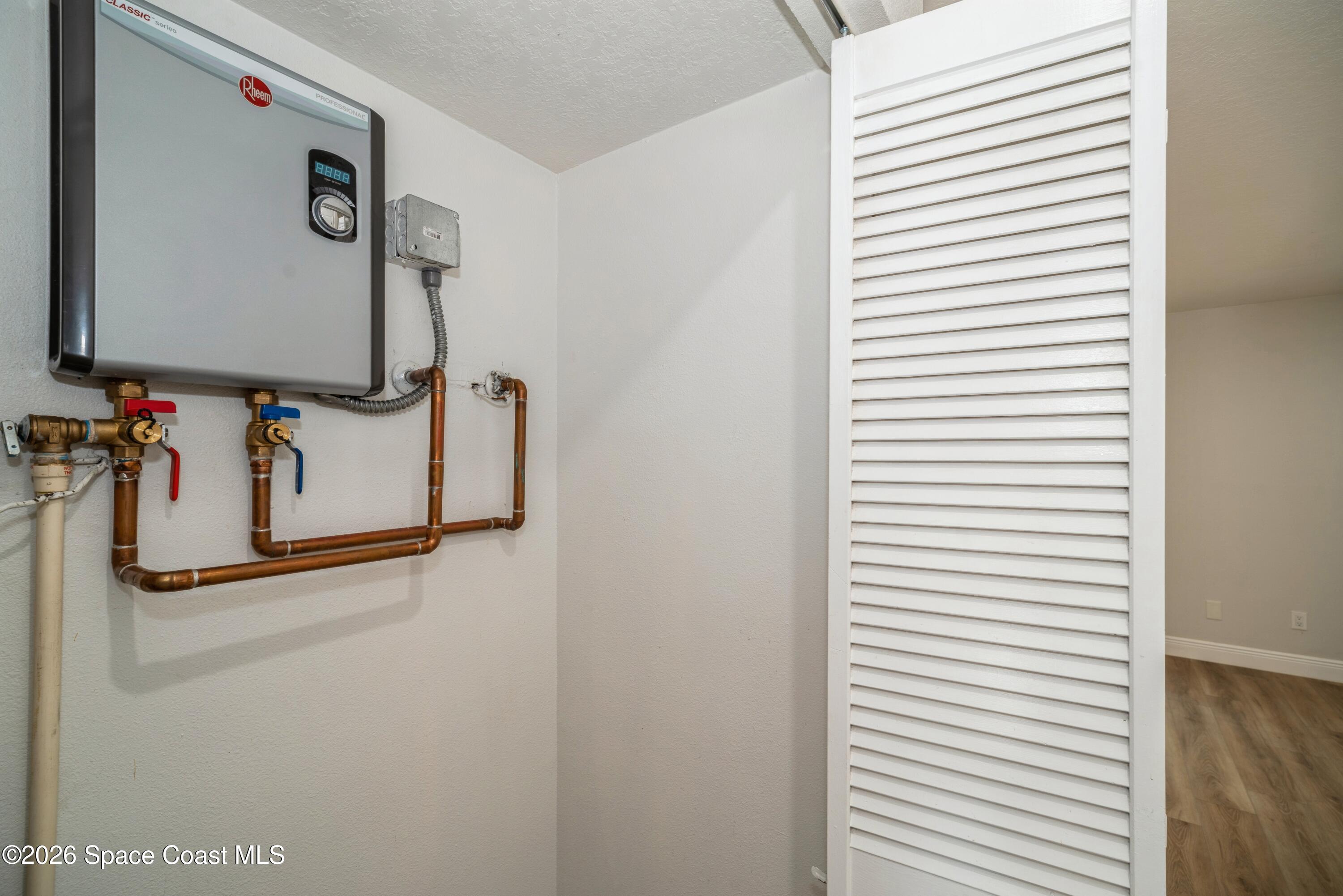 2018 Manor Drive Northeast Palm Bay, FL 32905 - Photo 14 of 29 a bathroom with a mirror and a sink
