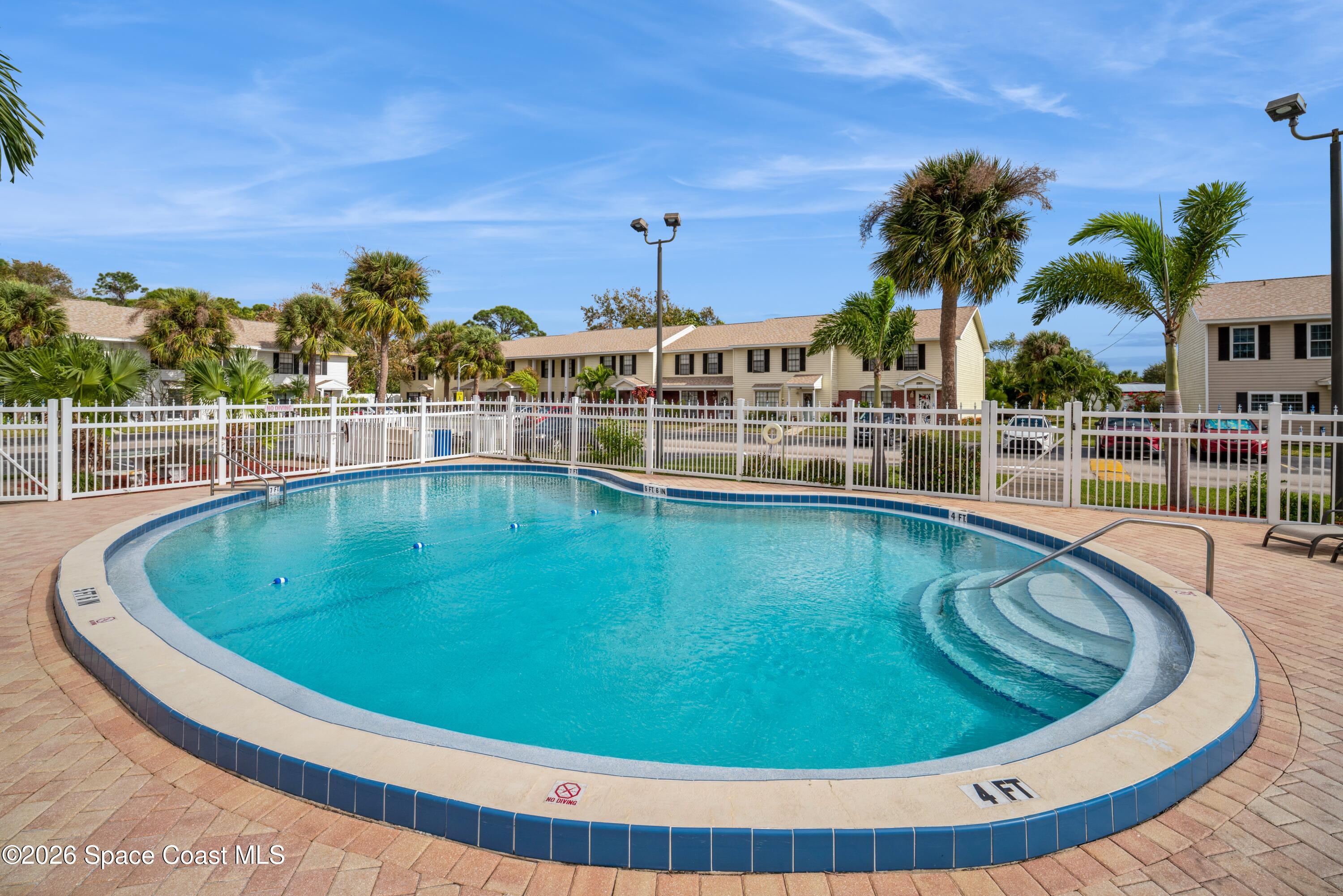 2018 Manor Drive Northeast Palm Bay, FL 32905 - Photo 29 of 29 a view of a swimming pool with outdoor seating