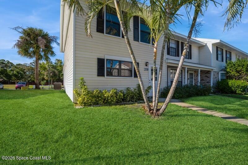 2018 Manor Drive Northeast Palm Bay, FL 32905 - Photo 3 of 29 a view of a house with a yard