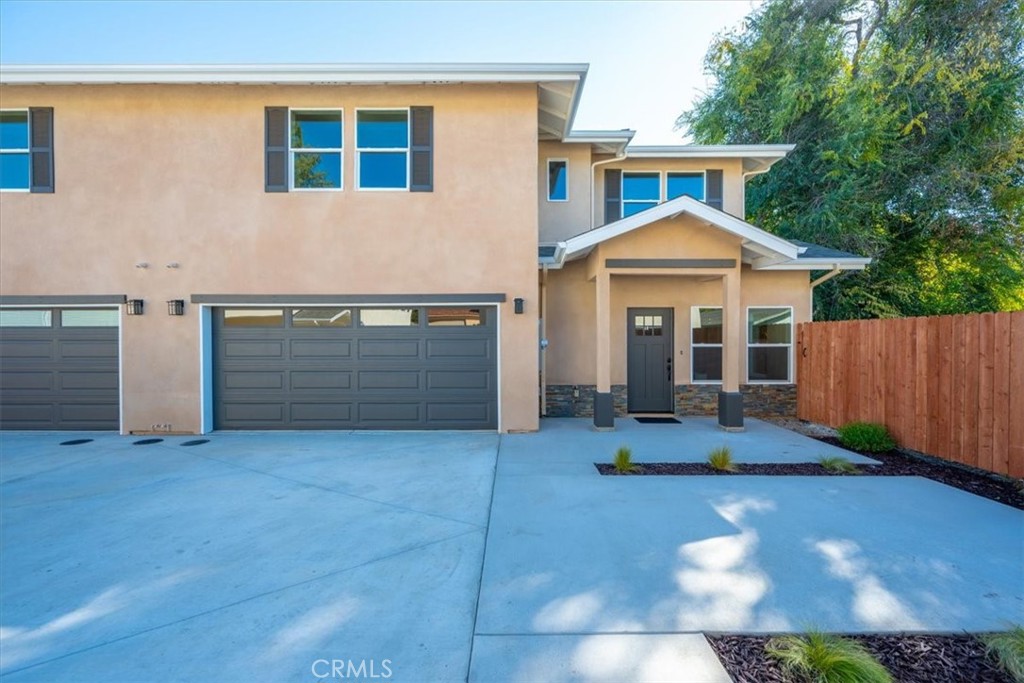 a front view of a house with yard