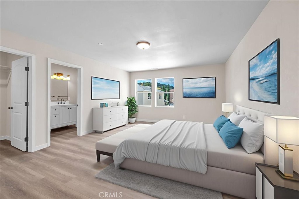 8395 Amapoa Atascadero, CA 93422 - Photo 11 of 22 a bedroom with a large bed and furniture