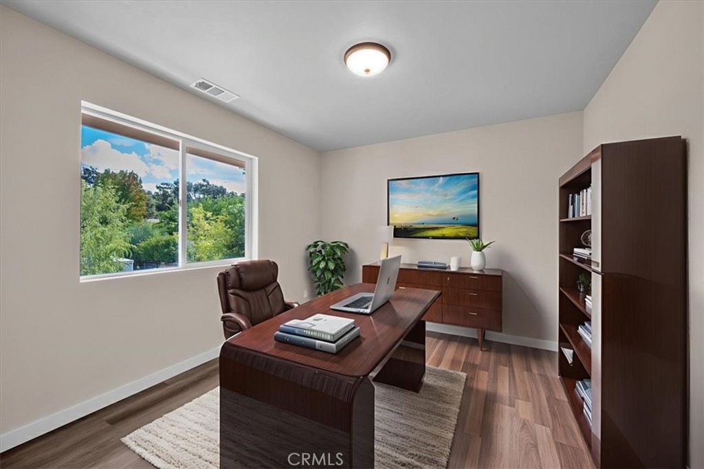 8395 Amapoa Atascadero, CA 93422 - Photo 17 of 22 a living room with furniture a large window and a flat screen tv