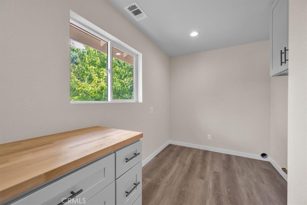 8395 Amapoa Atascadero, CA 93422 - Photo 19 of 22 a view of a kitchen with wooden floor and a window