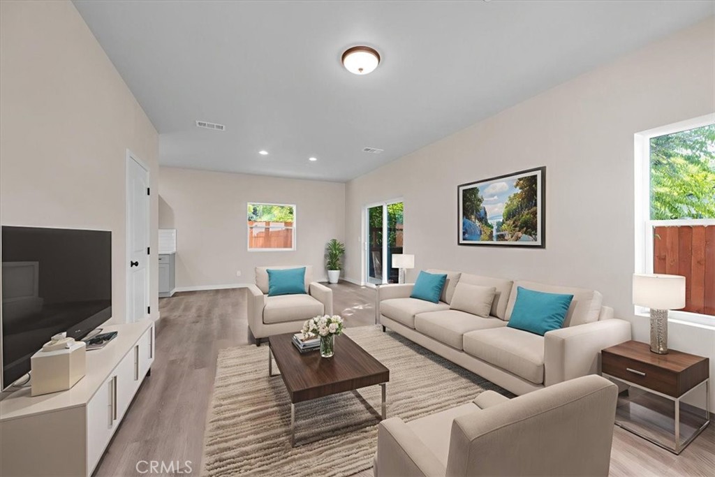 8395 Amapoa Atascadero, CA 93422 - Photo 4 of 22 a living room with furniture and a flat screen tv