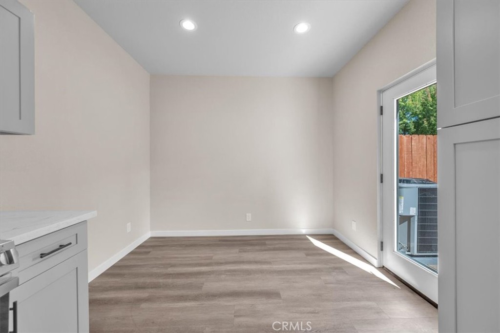 8395 Amapoa Atascadero, CA 93422 - Photo 9 of 22 a view of an empty room with wooden floor and a window