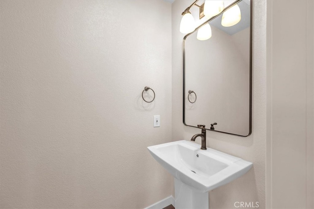 8395 Amapoa Atascadero, CA 93422 - Photo 10 of 22 a bathroom with a sink and a mirror