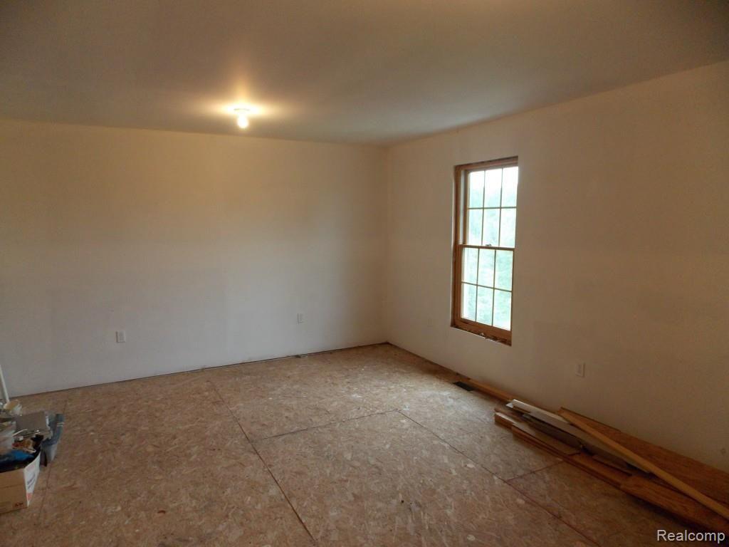 2974 Hannan Road Imlay City, MI 48444 - Photo 41 of 45 The bonus room is located on the 3rd floor and has never had the 6 x 6 spiral staircase installed. The room is insulated, heated, wired, and has central vacuum. Sellers never had a reason to purchase and install the spiral staircase due to the size and living space of the home. This could be a great place to draw, paint, or write for those that find themselves creative.