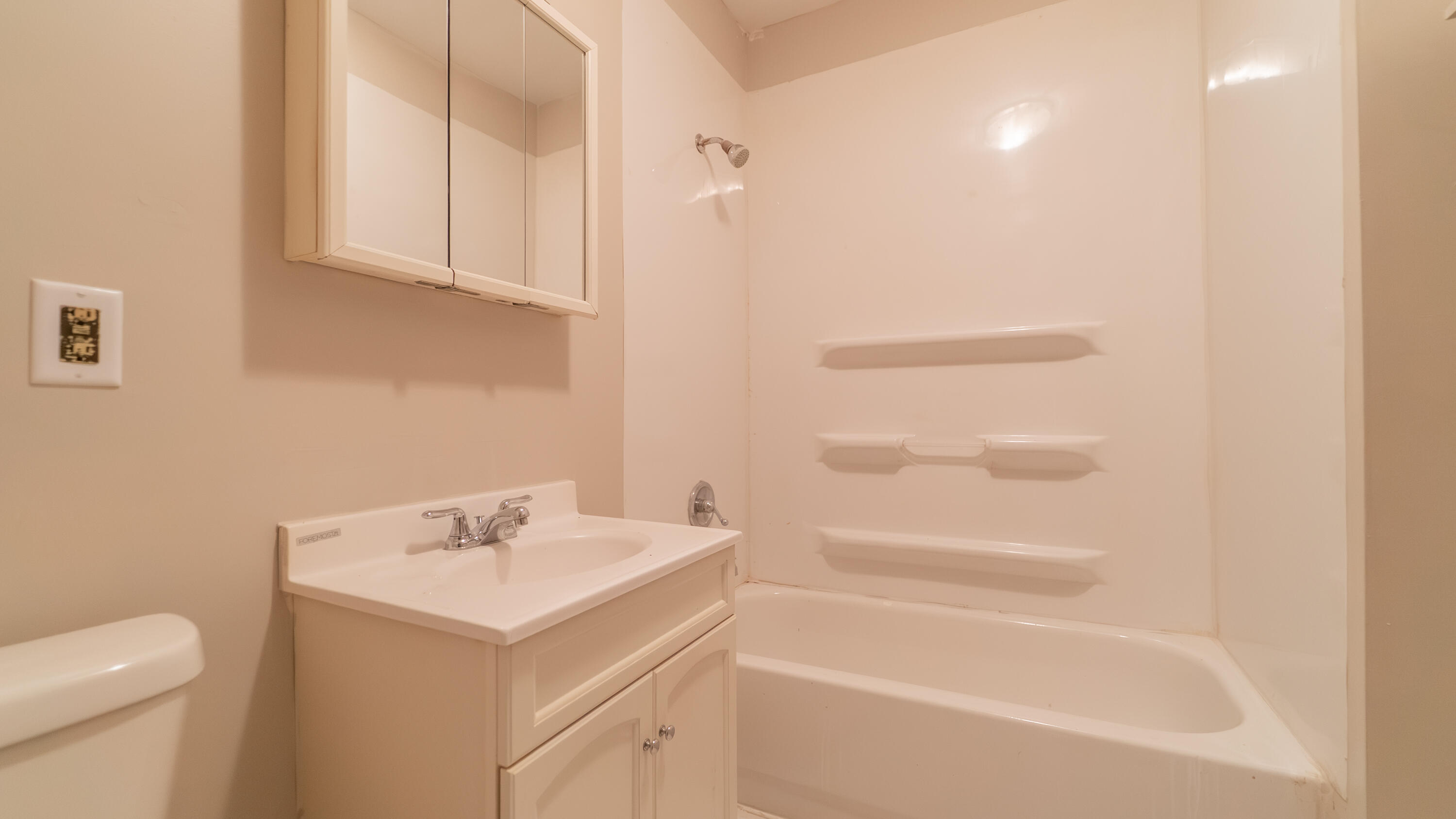 718 Cherry Street Hammond, IN 46324 - Photo 11 of 17 a bathroom with a sink a toilet and shower