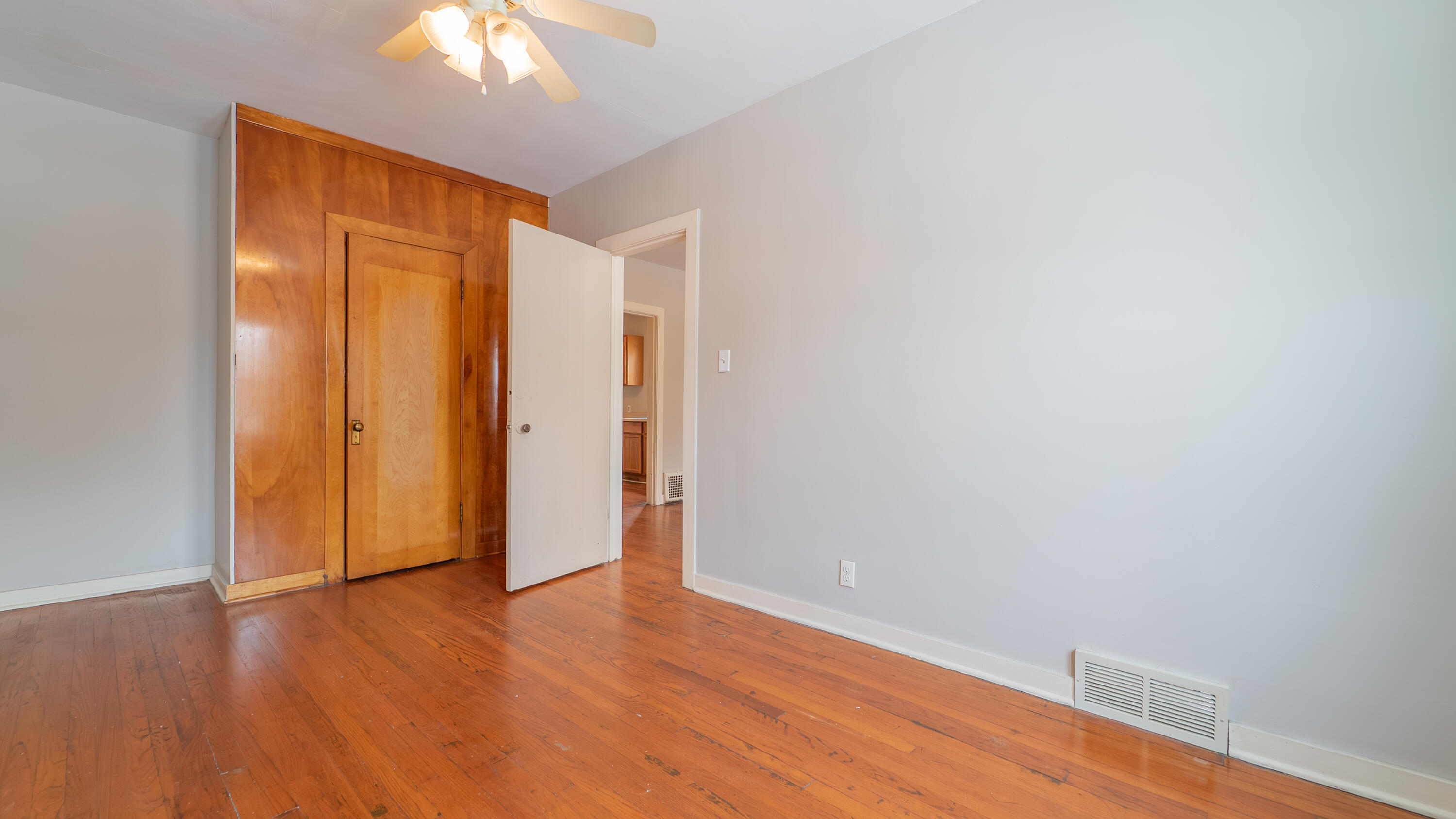 718 Cherry Street Hammond, IN 46324 - Photo 5 of 17 a view of an empty room with wooden floor