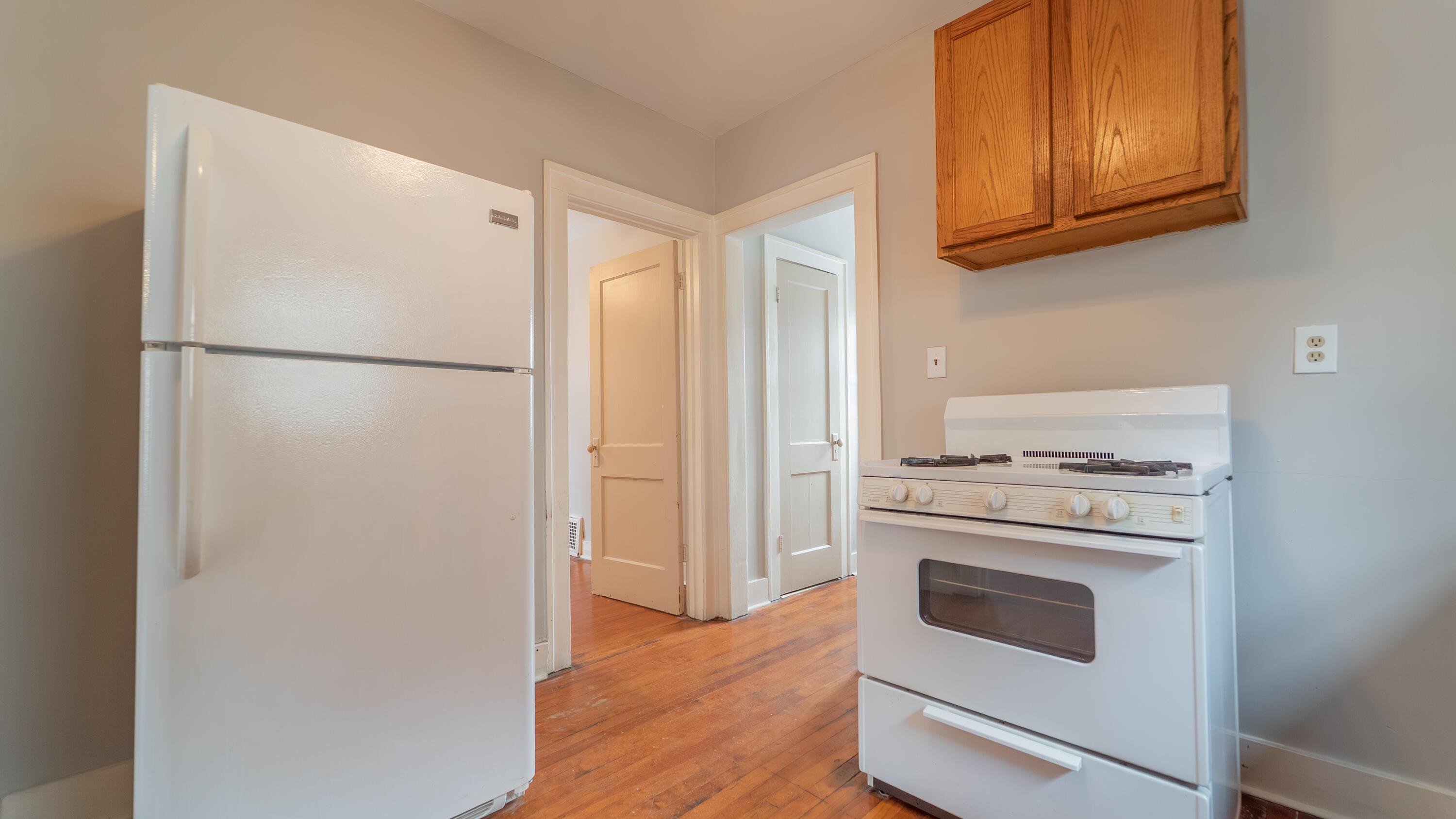 718 Cherry Street Hammond, IN 46324 - Photo 8 of 17 a kitchen with a refrigerator sink stove and cabinets