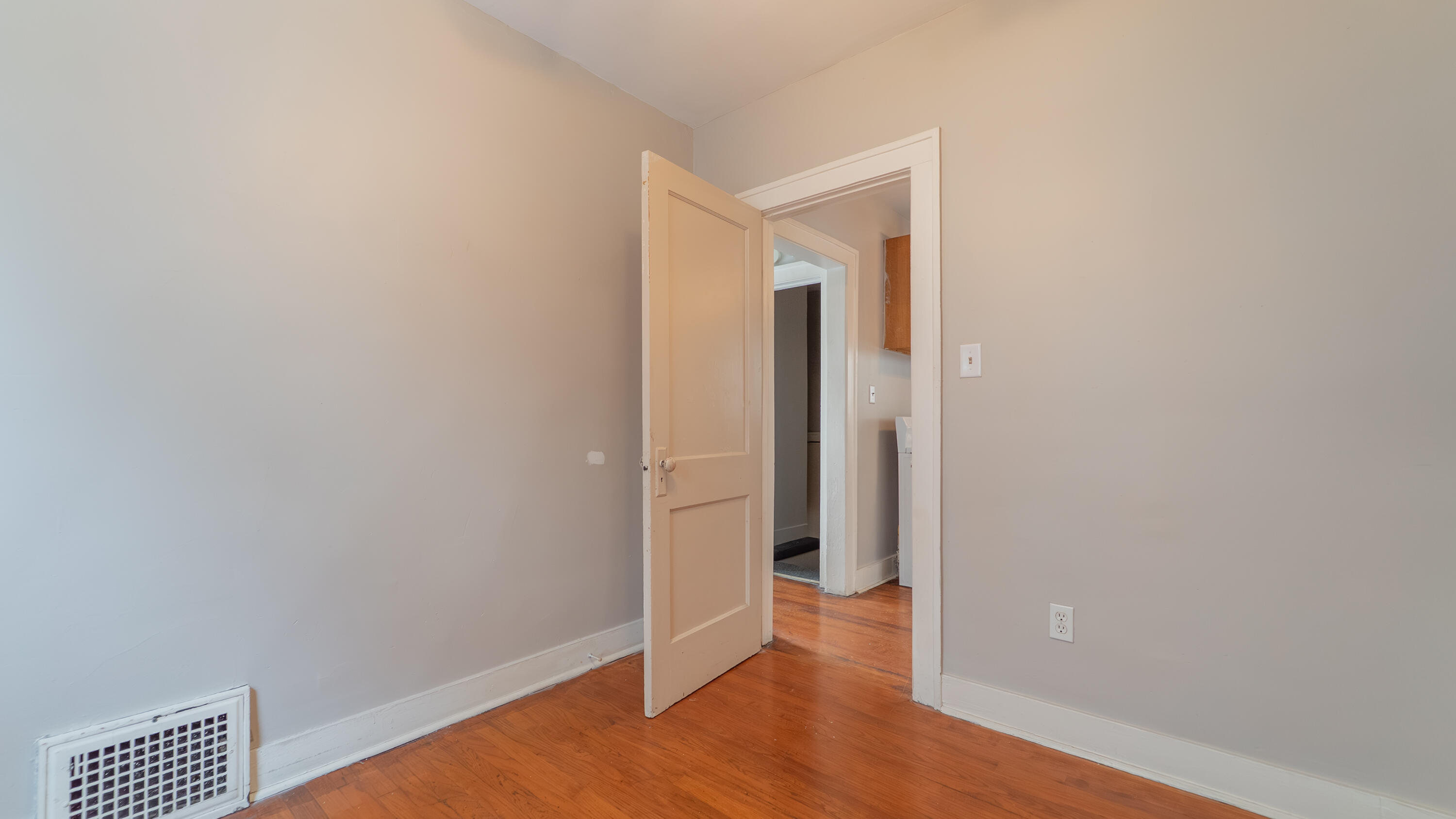 718 Cherry Street Hammond, IN 46324 - Photo 10 of 17 a view of an empty room with wooden floor