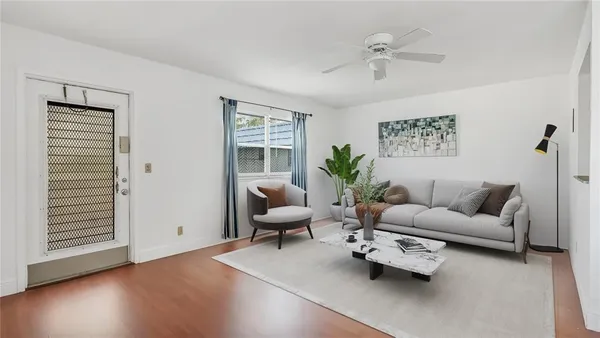 a living room with furniture and a window