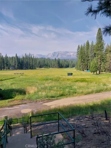 a view of a yard with an outdoor space and seating area
