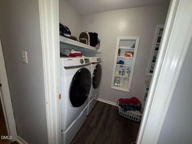 a view of a patio with a table and chairs